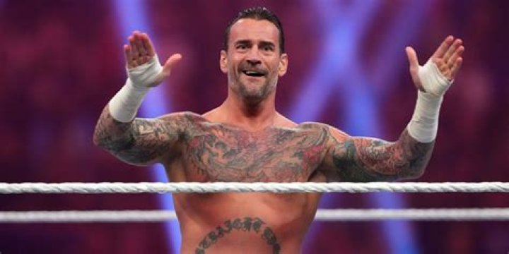 CM Punk pose for a photo during a screening episode of the Heels