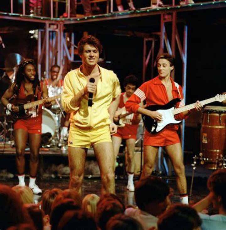Wham! members, George Michael and Andrew Ridgeley, smiling